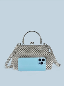 Handmade silver beaded handbag with chain strap and metal handle, shown with mobile phone