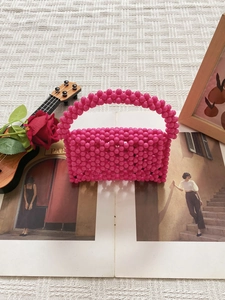 Handmade woven rose pink beaded handbag with retro geometric design and round handles