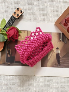 Handmade pink acrylic beaded handbag with triangle weaving in a vintage style