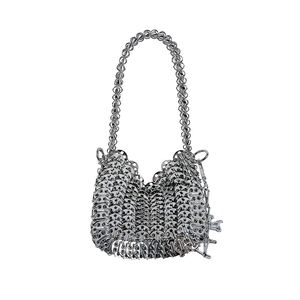 Detailed close-up of silver sequin chainmail shoulder bag with metal disk mesh