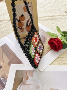 Handmade black beaded mini bag with floral patterns and top handle for women and girls