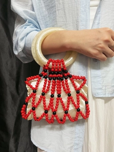 Handmade red and black beaded woven handbag with marble resin handles and satin lining