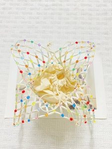 Handmade butterfly beaded tote bag with pearl accents and a beige drawstring inner pouch