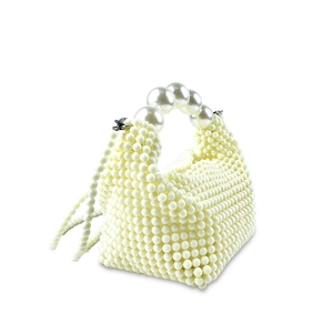 Detailed view of handmade ivory pearl beaded handbag with large pearl handle and strap