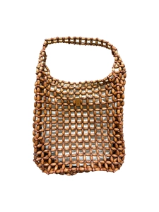 Detailed close-up of handmade retro wood bead woven handbag with cream canvas lining