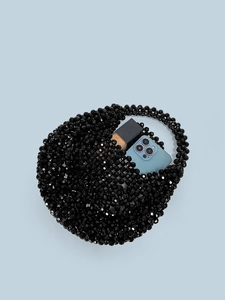 Handmade black acrylic beaded handbag with semi-moon shape showing daily interior capacity