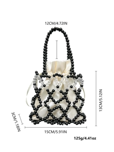 Detail view of woven beaded handbag with size specs and white drawstring satin pouch