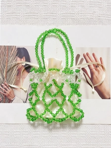 Handmade emerald green beaded tote bag with a cream satin drawstring inner pouch