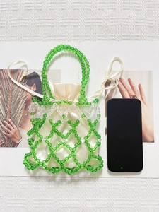 Handmade green beaded handbag with cream satin drawstring lining and woven pearl lattice