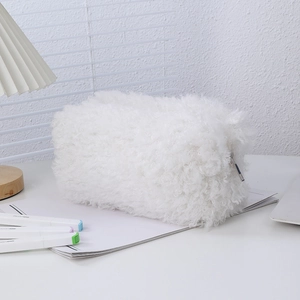 Close-up of soft white plush pencil case with textured fur and metal zipper detail