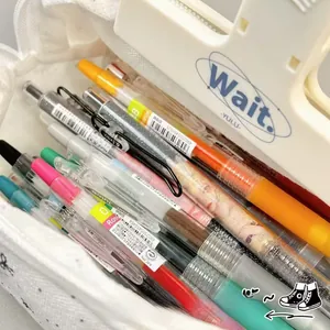 Top view of large capacity white bow pencil case showing internal storage for pens