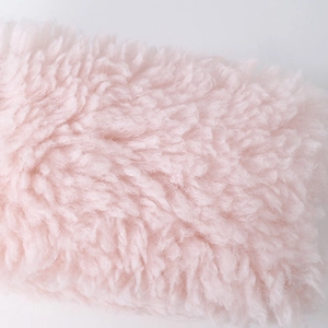 Close-up of soft pink faux lamb wool fabric with plush texture for large capacity pencil case