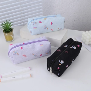 Detailed set of three floral pencil bags in blue, purple, and black with rabbit patterns