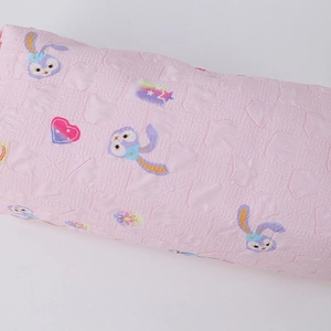 Close-up of pink floral pencil case showing StellaLou pattern and embossed fabric texture