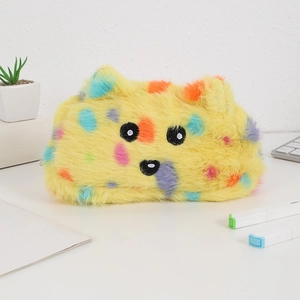 Detail of yellow plush animal pencil case with colorful spots and soft embroidery