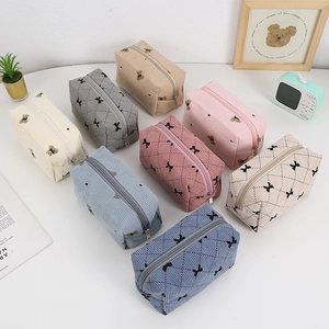 Corduroy makeup bags with cute bear prints and bow embroidery in multiple colors