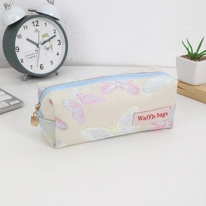 Detail of floral butterfly pencil case with smooth zipper and Waffle bags logo