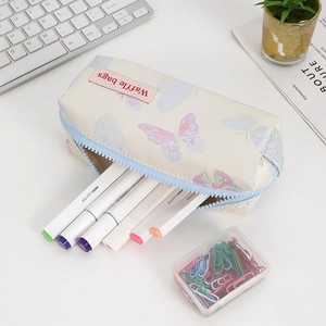 Detail of cream canvas pencil case with butterfly print and blue zipper closure