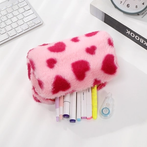 Macro view of plush pink pencil case with red heart showing large storage capacity