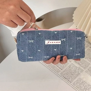 Stylish denim pencil case with white embroidery and pearl charm accessory