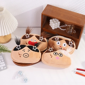 Close-up of funny cartoon plush pencil cases with creative facial expressions on a desk