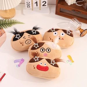 Detail of four funny plush pouches with cartoon embroidery and star hair clip accents