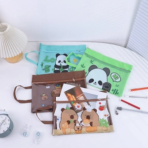 Close-up of A4 mesh document bags with cute panda and capybara cartoons and zippers
