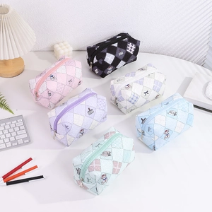 Detail of quilted bubble fabric pouches with cute bear patterns and zip closures