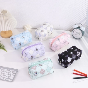 Close-up of quilted floral bubble fabric pencil pouches in various pastel colors
