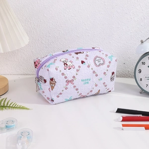Detail of lavender quilted pencil case with cute lamb and floral cartoon patterns