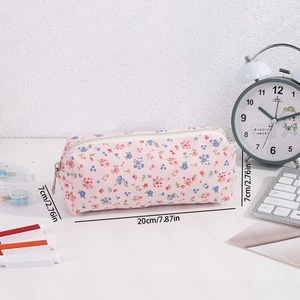 Floral canvas pencil case measuring 20cm by 7cm with pink flower pattern and silver zipper