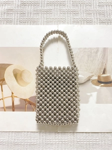 Handmade silver metal beaded handbag with a minimalist woven sphere design and top handle