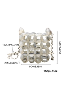 Detailed view of handmade beaded mini bag with marble resin beads and silver chain strap