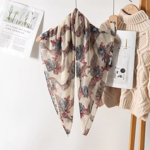 Detailed view of lightweight pleated voile scarf with elegant grey and red floral rose prints