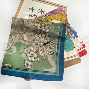 Elegant vintage floral silk scarf set with botanical patterns on marble background