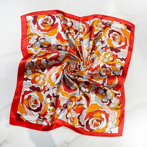 Luxurious satin square scarf featuring vintage rose patterns with vibrant red borders