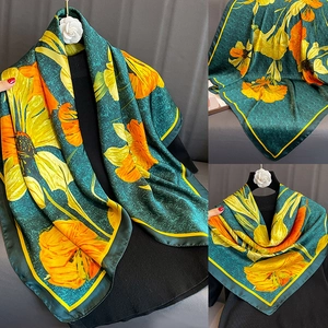 Elegant 90cm floral silk scarf in dark green with yellow and orange blooming patterns