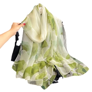 Translucent long summer scarf with green and white leaf print for beach sun protection