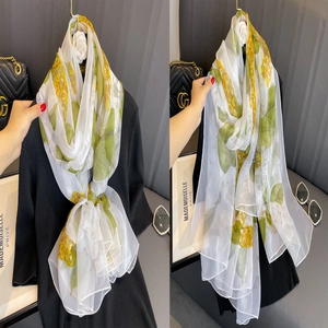 Elegant white silk scarf with green ginkgo leaves and yellow flowers for sun protection