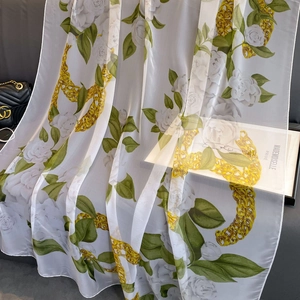 Elegant green camellia and gold chain printed silk scarf for sun protection and beachwear
