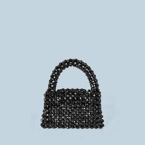 Detailed view of hand-woven black acrylic faceted beads on a mini square tote handbag