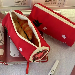 Red canvas pencil cases featuring embroidery strawberry and star patterns in two shapes