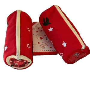 Red cylindrical pencil case with star embroidery and heart detail for students
