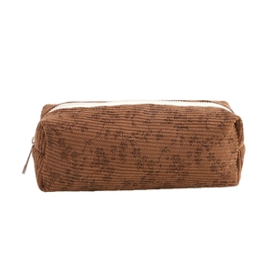 Brown corduroy floral pencil case with white zipper closure for stationery storage