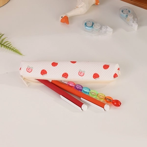 Close-up of strawberry waffle pencil pouch showing internal capacity and stationery