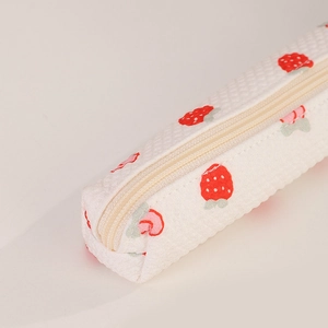 Close-up of strawberry print pencil case with durable zipper closure and fabric texture