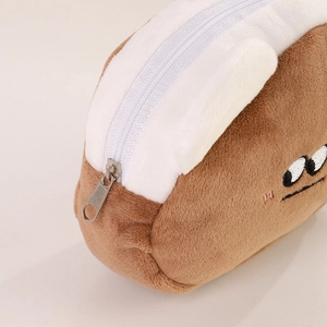 Close-up of toast shaped plush coin purse with brown soft fabric and cute embroidery