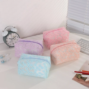 Floral mesh cosmetic organizer set in pink, purple, and blue with daisy embroidery
