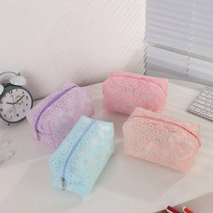 Floral mesh makeup bags in purple and pink with delicate 3D daisy embroidery