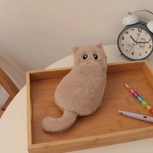 Close-up of cute plush cat pencil case with soft fur and embroidered cat face features